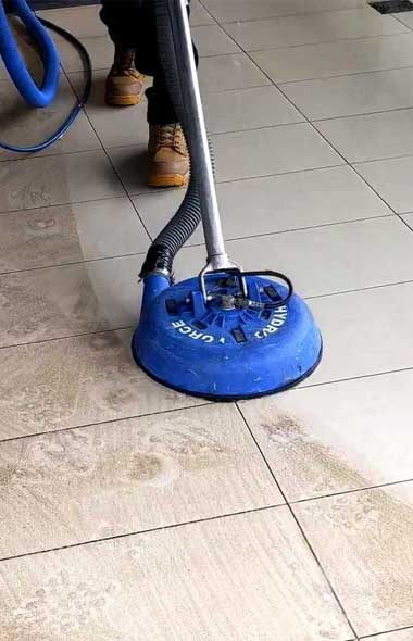 Tile and grout cleaning with rotary machine